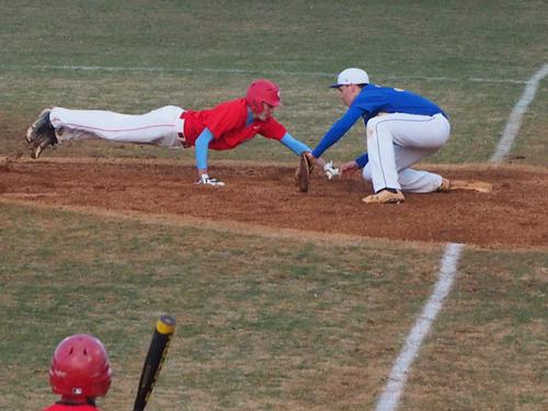 A ram player narrowly tags out an oncoming runner in the game against Marshall