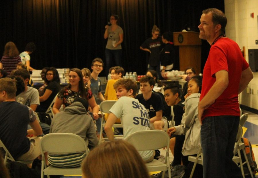 Jason Woehrmyer talks with students at the New Kids on the Block assembly on Sept. 13. Woehrmyer joined the Robinson counseling staff this year. He handles students whose last names start with A-Bram.