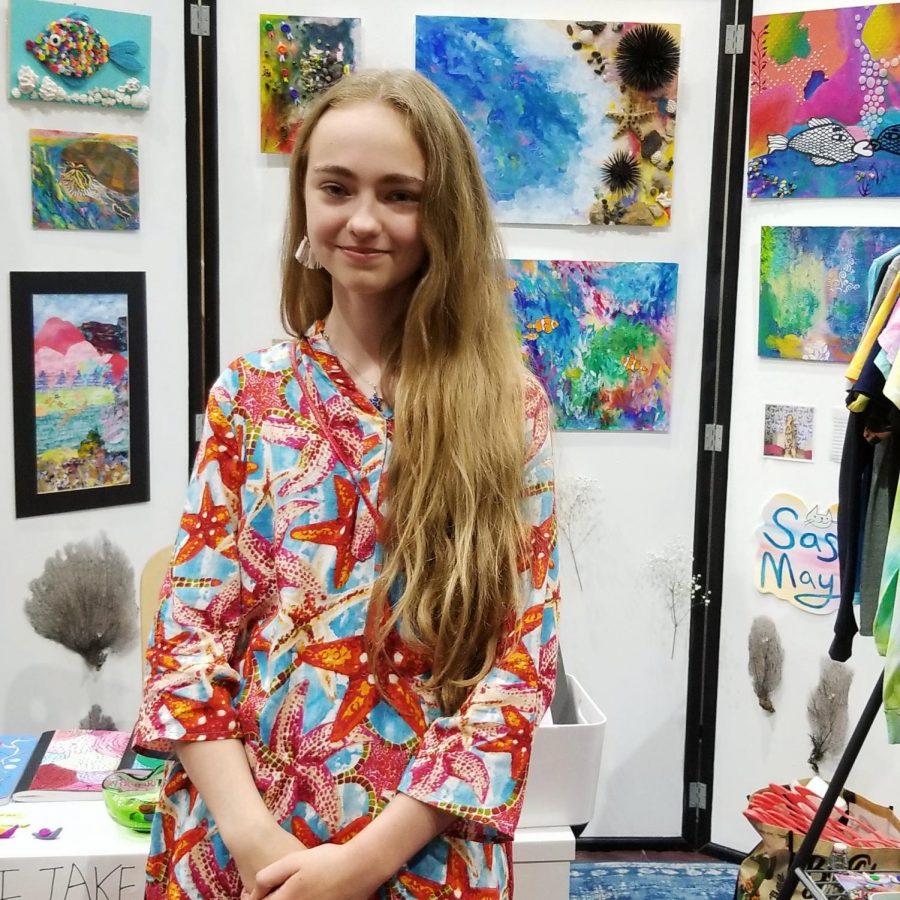 This is Sasha May with her one person booth at the art show.