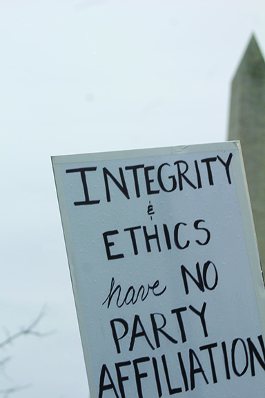 The photo states “Integrity & Ethics have no party.”