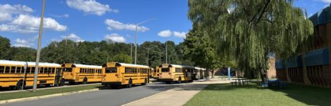 Buses in the front of the school
