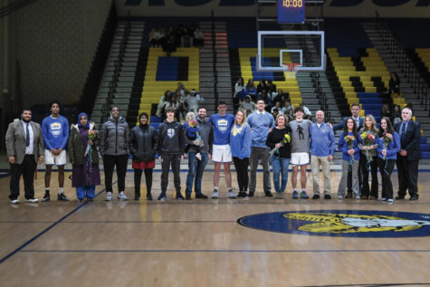 The basketball team celebrates Senior Night with their families. “It was the most people I’ve had come watch me play”, said Yassin. “It meant everything.”