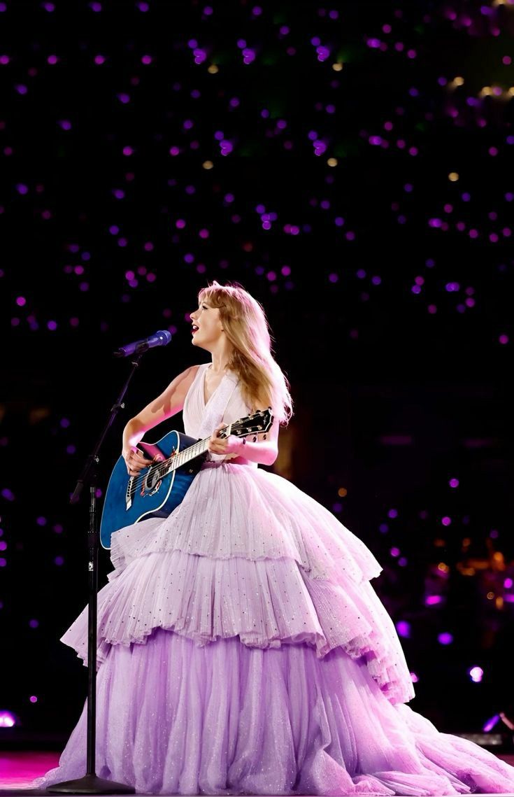 Taylor Swift playing 'Enchanted' at the Eras Tour, circa November 2023 in Buenos Aires